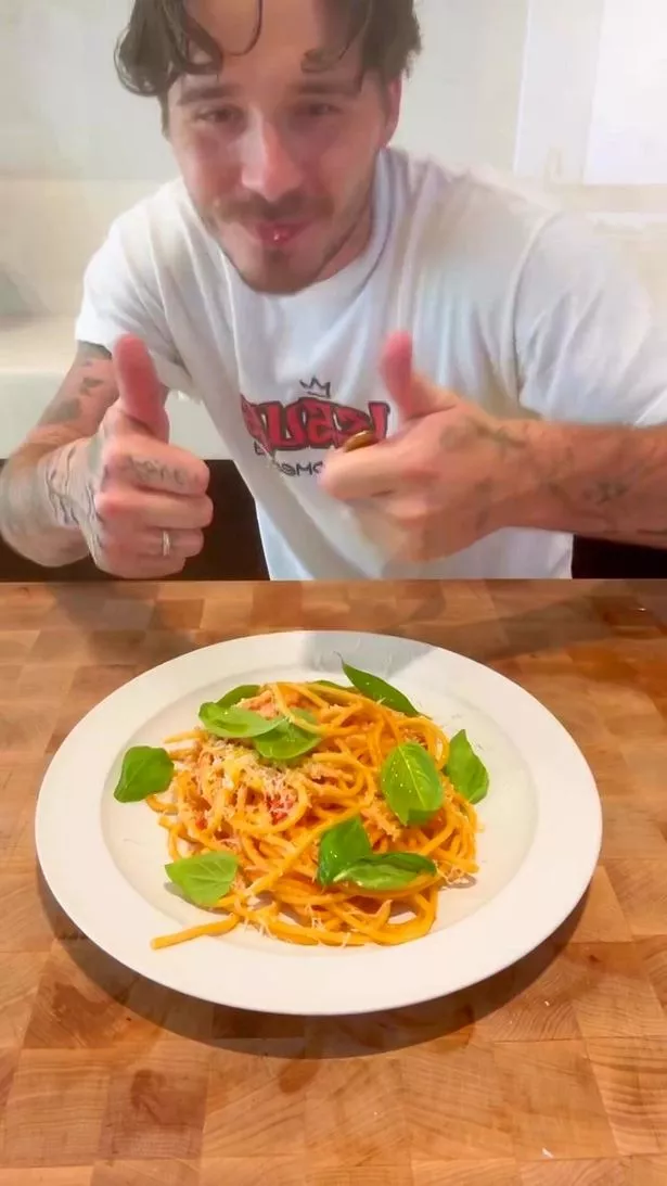 After completing the cooking process, he presented the dish to his wife,