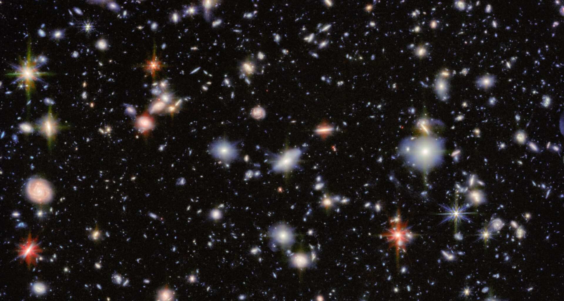 Red galaxies provide new insights into the birth of the universe