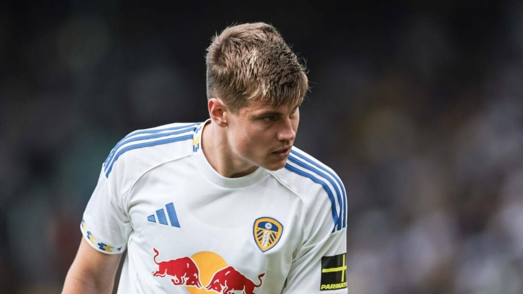 Jaka Bijol leans forward playing for Leeds
