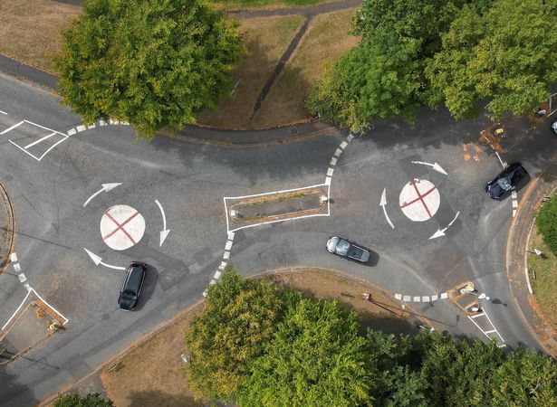 St George's Flag painted on a three mini roundabouts on Firs Road , Sale