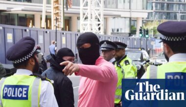 Police officer ‘punched in face’ as four arrested at London anti-asylum protest | UK news