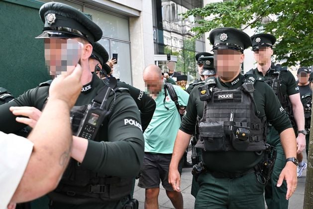 Woman arrested in Belfast for wearing Palestine Action at anti-racism demonstration