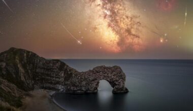 Perseid meteor shower captured over Durdle Door, Dorset