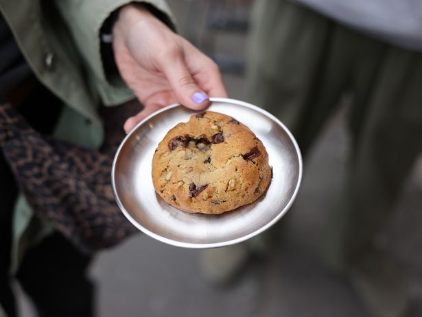 Cyrus bakes cookies in varieties including Lemon and Earl Grey, Matcha with Macadamia, and Oreo Dark & White Chocolate Chip