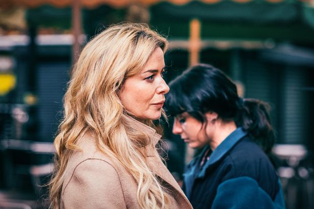 A close up of two women on the street 