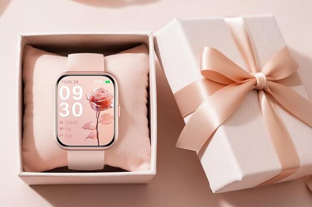 The pink smart watch in a matching box 