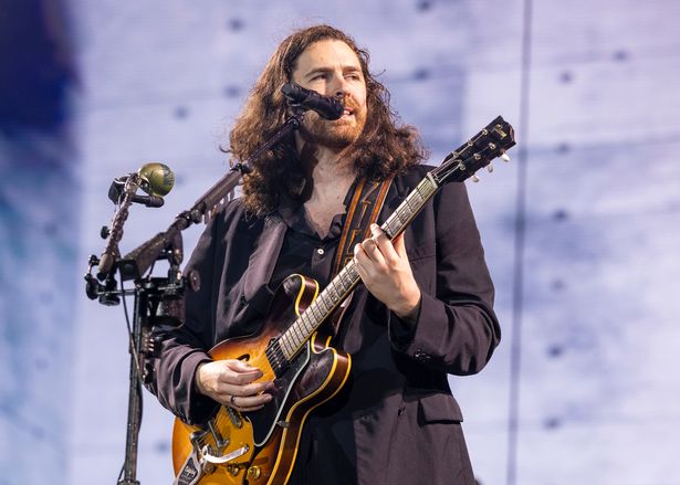 Hozier performing on stage