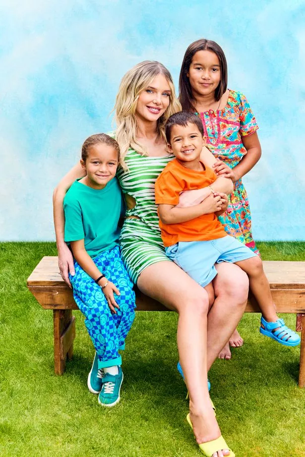 Helen flanagan sat on garden bench with her kids