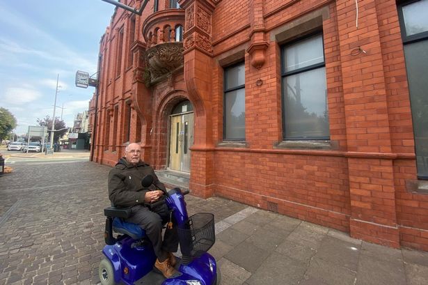 Doug Eastman outside the closed Hoylake Town Hall. 