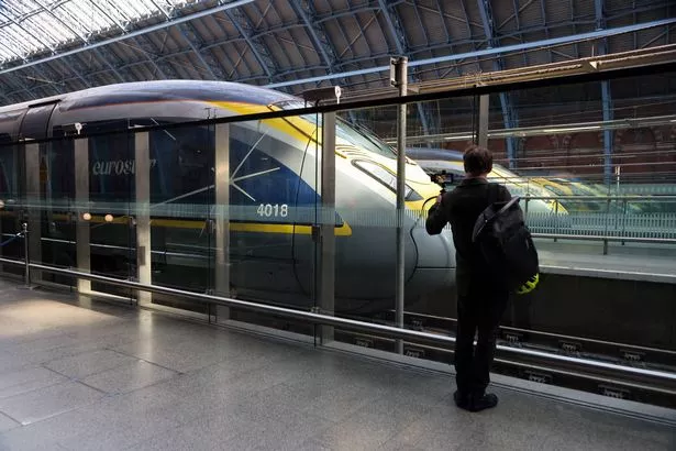 LONDON, UNITED KINGDOM - 2025/03/07: A man seen standing next to the Eurostar trains in and out of London St Pancras International station, as they are being cancelled following the discovery of an unexploded World War II bomb found on tracks near Paris.