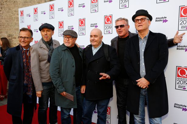 Dan Woodgate, Lee Thompson, Chris Foreman, Graham McPherson aka Suggs Mike Barson and Chas Smash from Madness. 