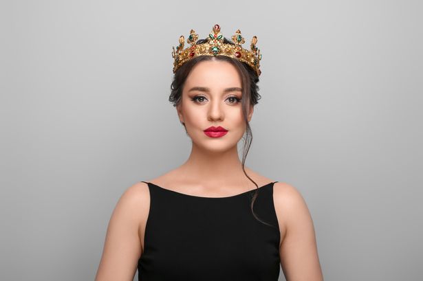 A woman wearing a crown