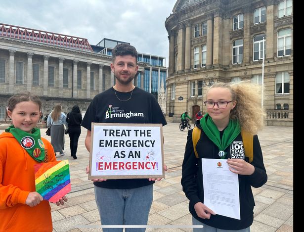 Young campaigners Tillie and Emmeline from Woodcraft Folk with Better Streets chairman Martin Price at the road safety emergency anniversary event