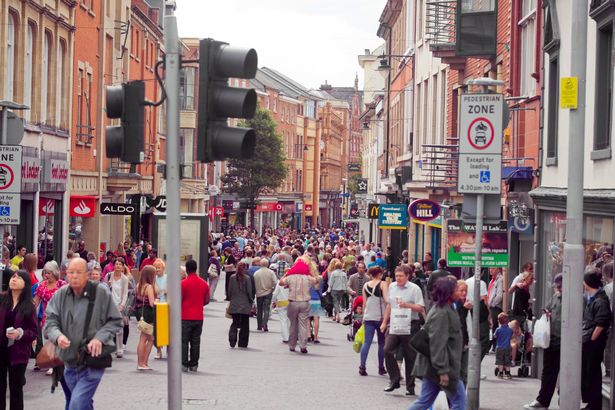 Stock image showing hundreds of people walking through a shopping street in Nottingham