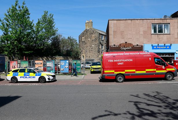 Police and investigators from the Scottish Fire and Rescue Service at the scene.