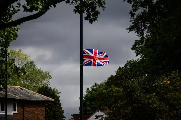 A flag above a Birmingham residential street on August 18, 2025