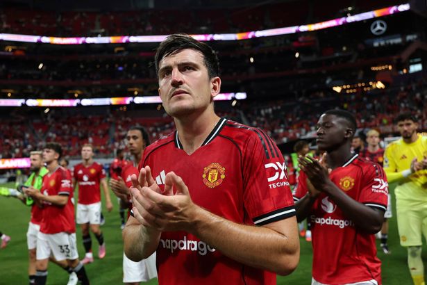 Harry Maguire claps the fans