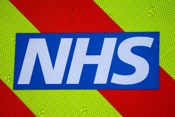 An NHS logo is displayed on an ambulance outside the Royal London Hospital on September 12, 2024 in London, England. 