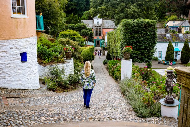 A woman standing on a path