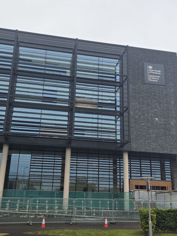The building with a boundary, cones and tape around it