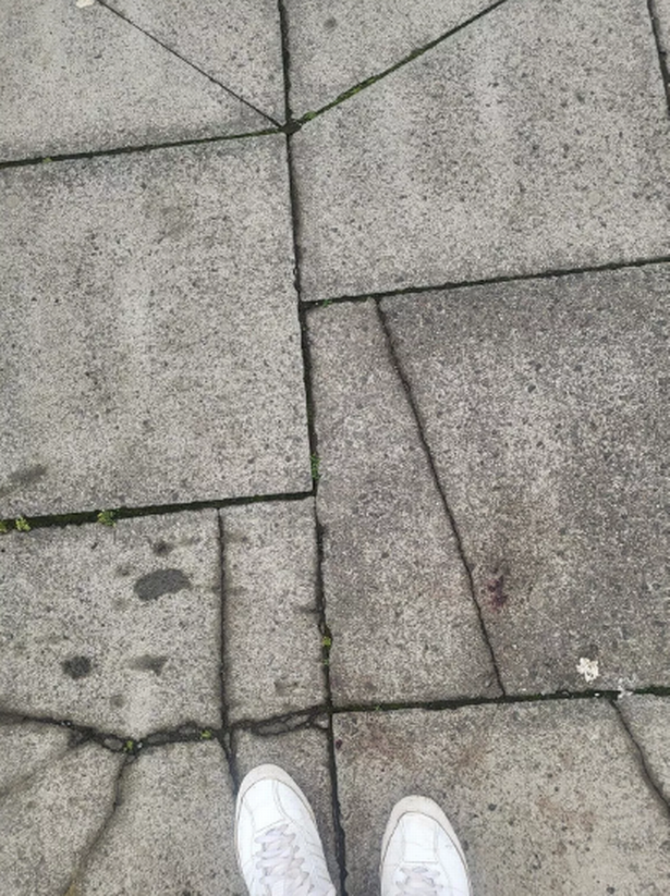 Helen fell over the uneven paving
