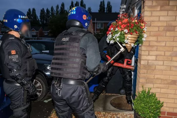 Officers bashed down doors in a string of Irlam raids