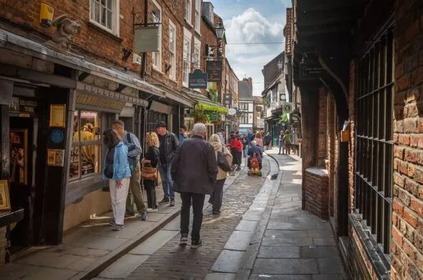 General view of people walking down a street in York, Yorkshire