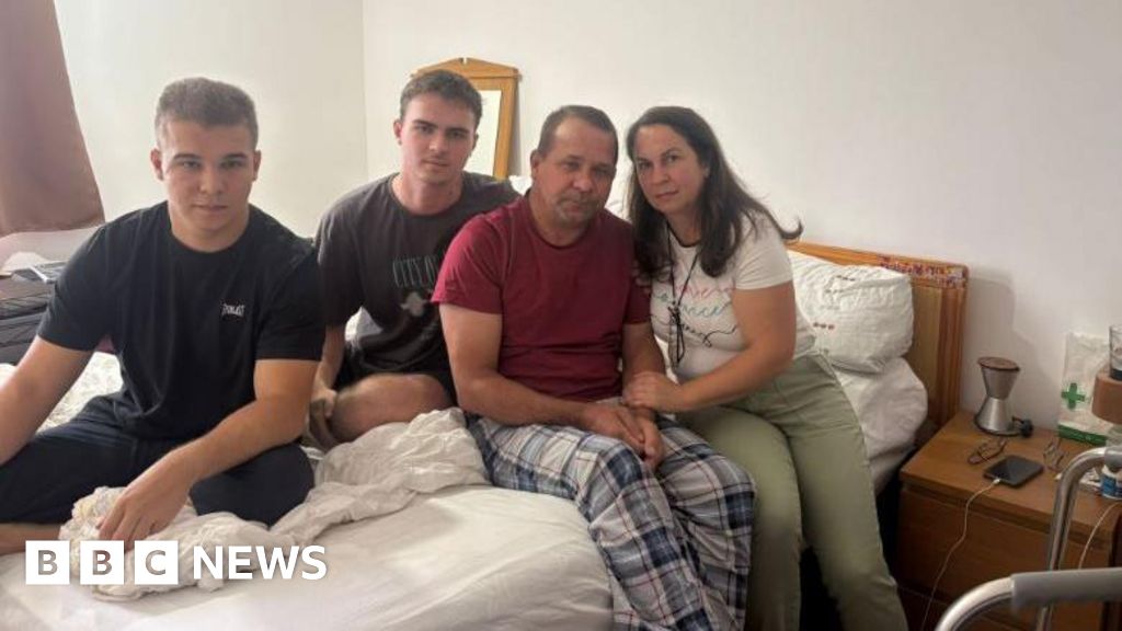 Ukrainian family forced to lift father down stairs due to broken lift