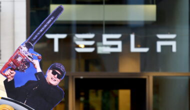 Activists of the "New Generation" (Neue Generation) and Extinction Rebellion protest in front of a Tesla store in Berlin