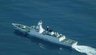 An aerial view of a China Coast Guard ship navigating near the disputed Scarborough Shoal, as Philippine Coast Guard aircraft carrying journalists patrols the area