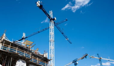 Cranes stand above a building construction site in the NOMA neighborhood of Washington
