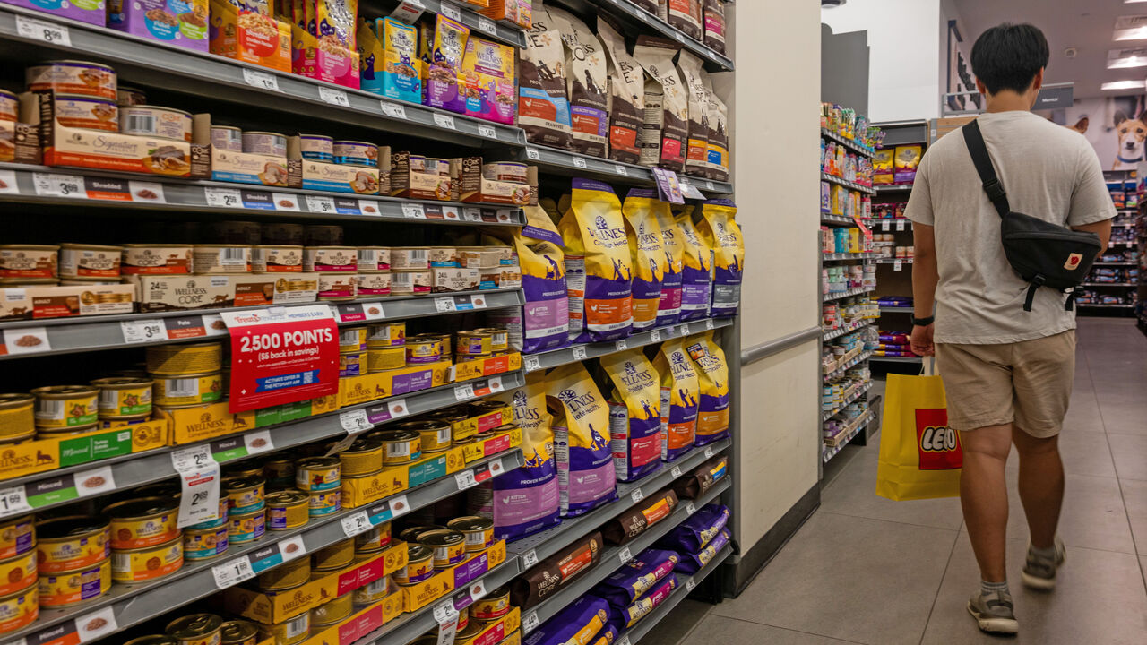 People shop for pet supplies at a pet retail store in Manhattan, New York City, USA.