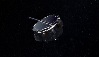 A disk-shaped spacecraft hovers in space in front of a background of stars.