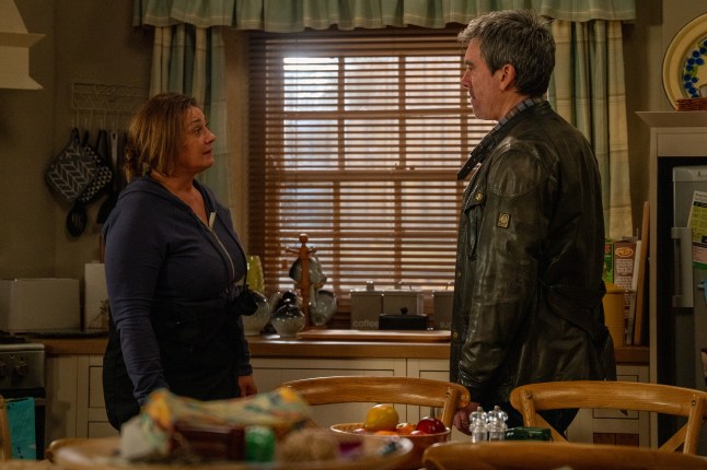 Moira and Cain Dingle facing each other during a talk at Butlers in Emmerdale.