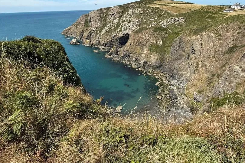 A cliff surrounded by water