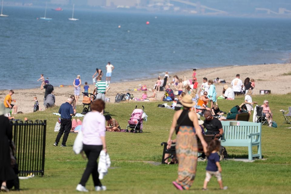 People enjoy a walk in Sea Park, Holywood during the warm weather on Tuesday. Picture by Jonathan Porter / PressEye