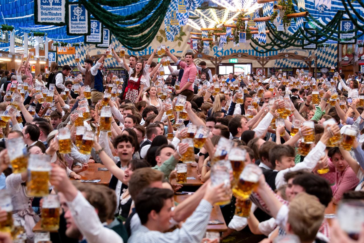 Oktoberfest beers raised in a collective cheers.