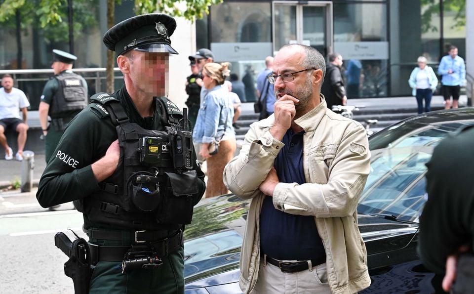 Patrick Corrigan from Amnesty International in Belfast as  counter-protestors gather in opposition against a protest in Belfast city centre behind Belfast City Hall. Several dozen anti asylum seeker  protestors gathered outside a Belfast hotel.  Photo by  Press Eye.