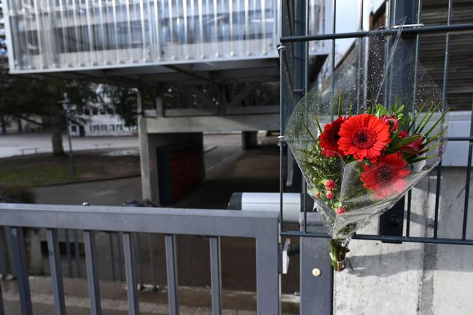 A bouquet of flowers placed at a middle school in memory of a 13-year-old boy who took his own life, in Golbey, France, January 2023.