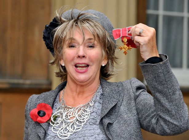 LONDON - NOVEMBER 5:  Actress Sue Johnston celebrates after receiving her OBE from Queen Elizabeth II at Buckingham Palace on November 5, 2009 in London, England. (Photo by Ian Nicholson / WPA Pool / Getty Images)
