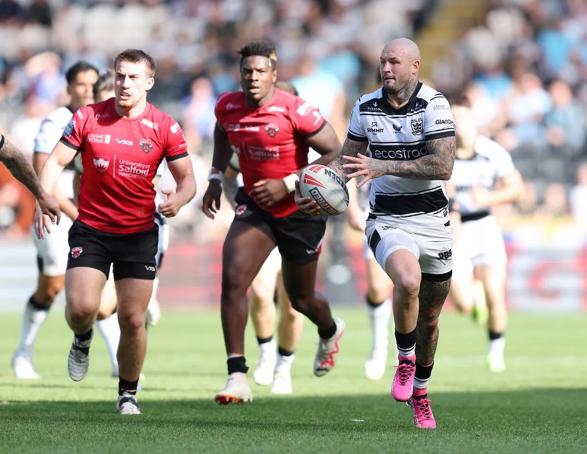 Salford Red Devils' Justin Sangare, middle, tries chasing down Hull FC's Zak Hardaker