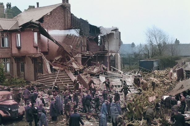 The scene in Temple Drive in Swinton, as rescuers dug through the rubble looking for survivors. Photo colourised