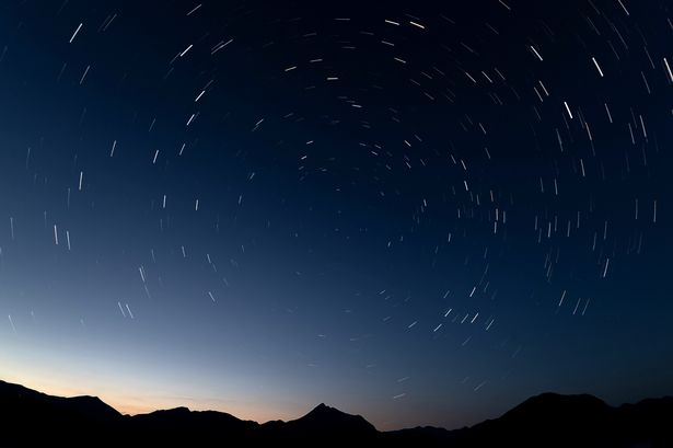 A long exposure photo shows night sky on the Perseid meteor shower above Spain