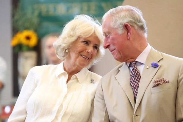King Charles and Camilla, Queen Consort, look at each other as they reopen the newly-renovated Edwardian community hall The Strand Hall during day three of a visit to Wales on July 4, 2018 in Builth Wells, Wales