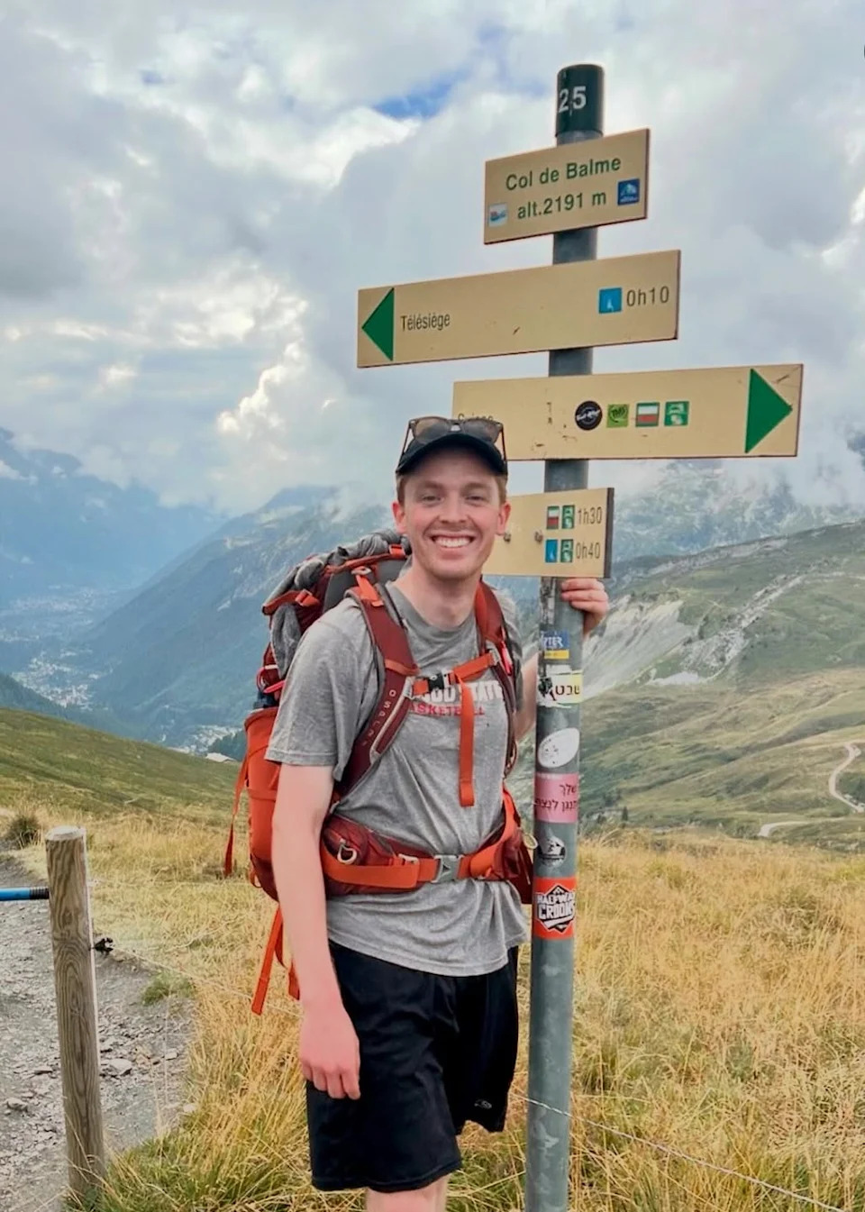 Cole Henderson, 27, is pictured hiking near the border between Switzerland and France.
