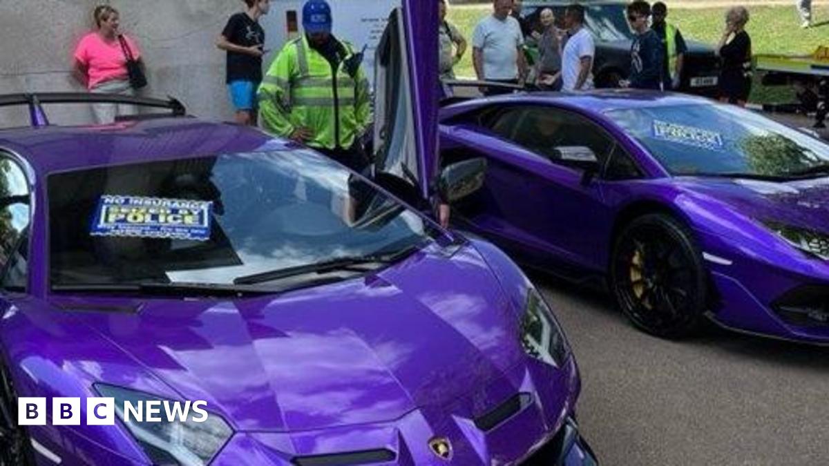 Two purple Lamborghinis, each with a sign that reads: "Seized by Police" on the windscreen.
