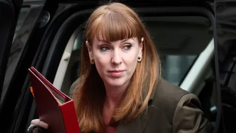 Reuters Deputy Prime Minister Angela Rayner exits a vehicle in Downing Street in London, Britain, March 26, 2025.