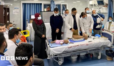 Medical students train with plastic dummies.