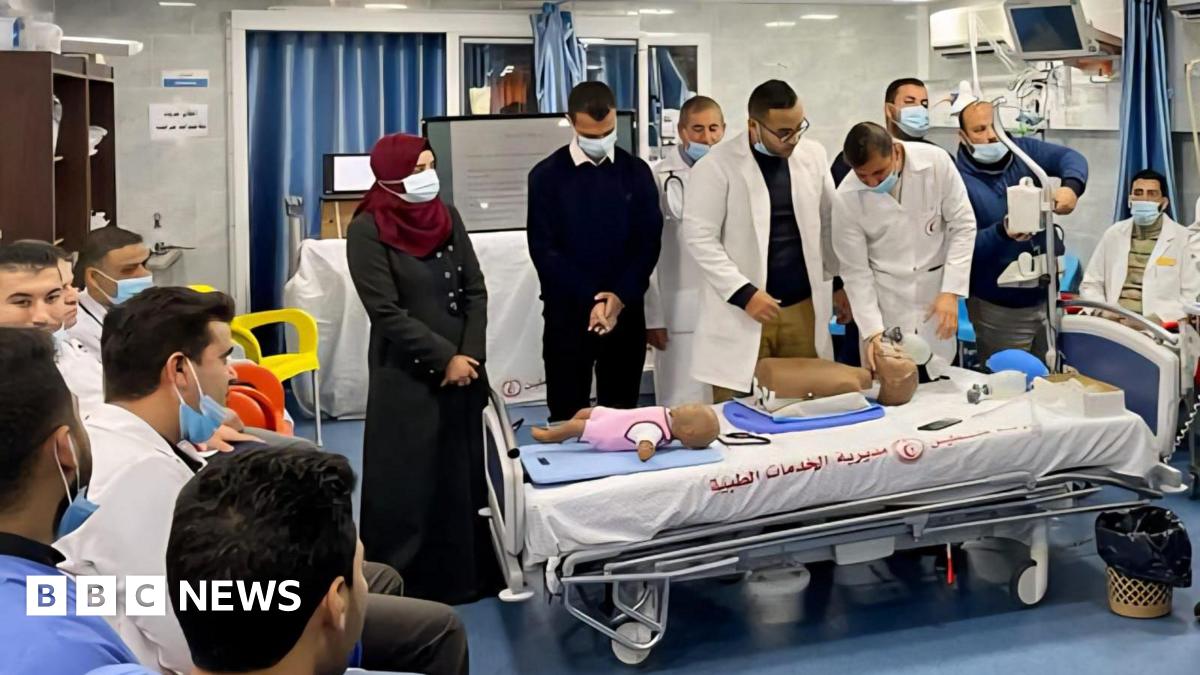 Medical students train with plastic dummies.