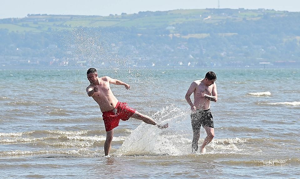David Johnston and Gary Aitcheson pictured enjoying the nice weather at Hazelbank beach. Pic: Pacemaker Press.